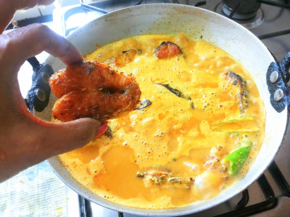 adding fried fish