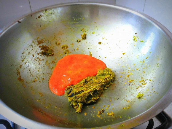 adding tomato paste