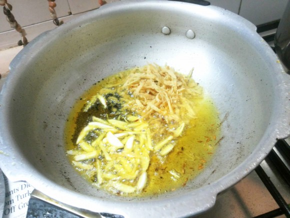 Add crushed ginger and garlic 