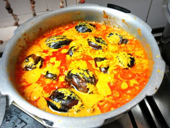  Add salt, fried brinjal and tomatoes