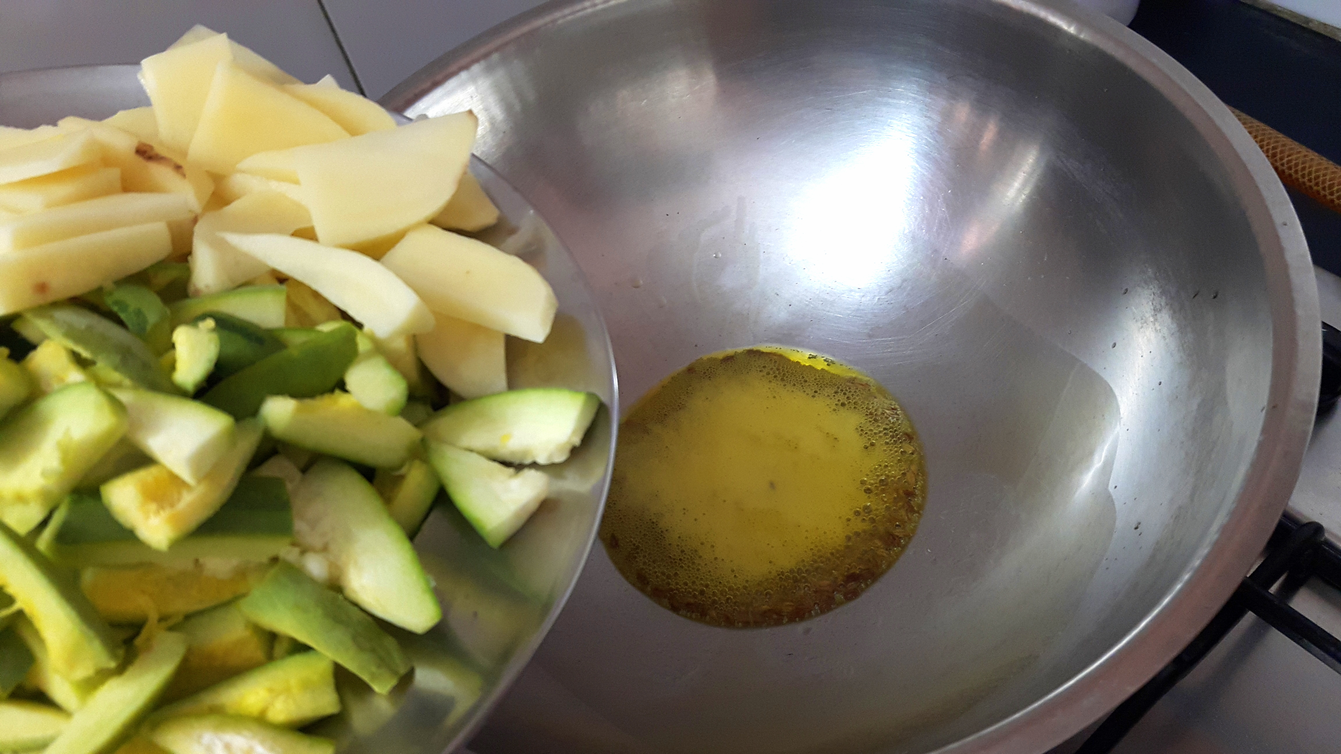 Drop chopped potatoes and sliced Parwal