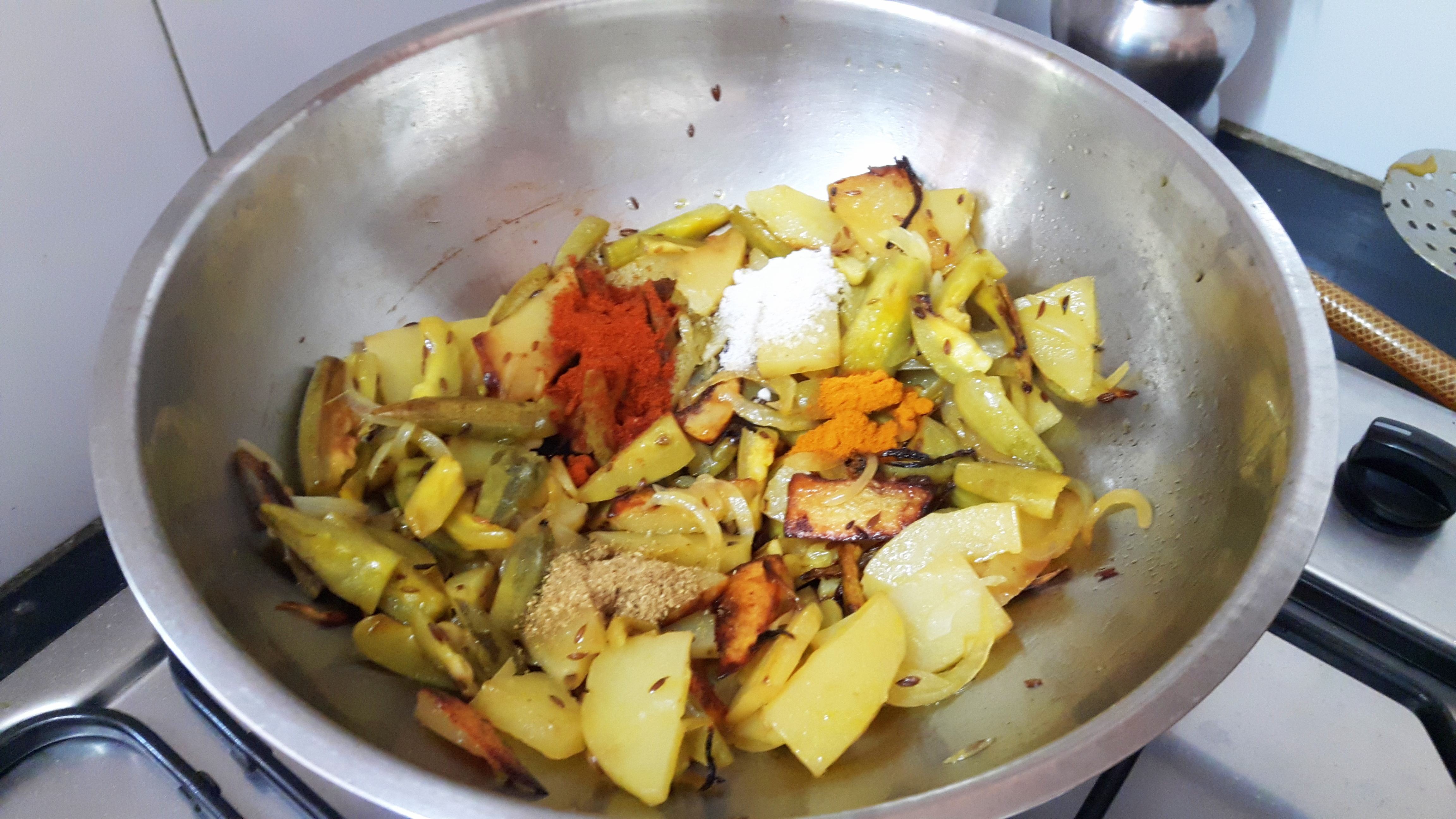 Add chili powder, coriander powder, turmeric powder and salt