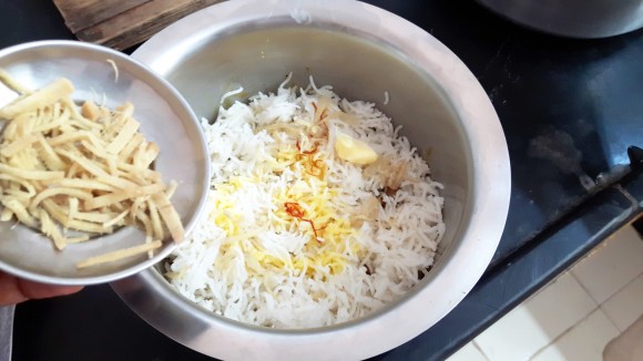 fried onion and 1 tablespoon of butter, ginger Julian Garam masala powder, rose water and kewada essence. 