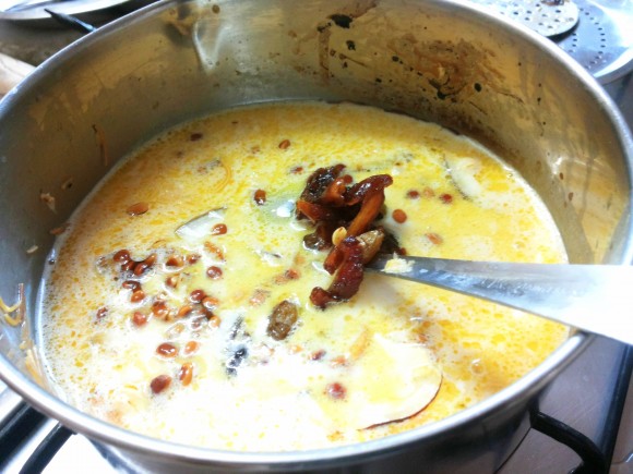 adding dry fruits into the seviyan