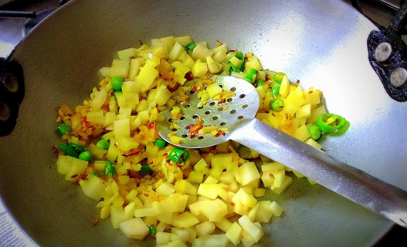 frying onion and potato