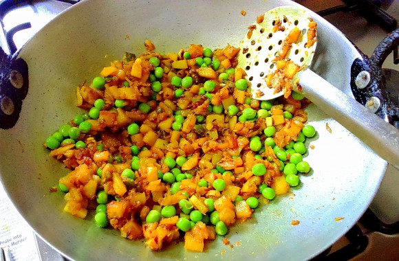 frying onion,peas and potato
