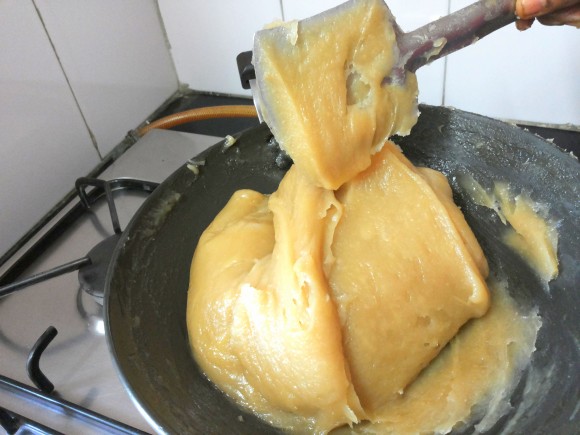 adding ghee spoon by spoon 