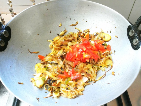 adding tomato