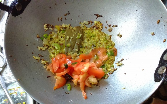 adding tomato