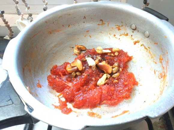 Garnish with cardamom powder and cashew nut