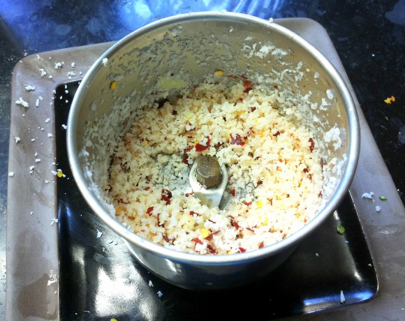 Roughly grind scrapped coconut, red chili and garlic