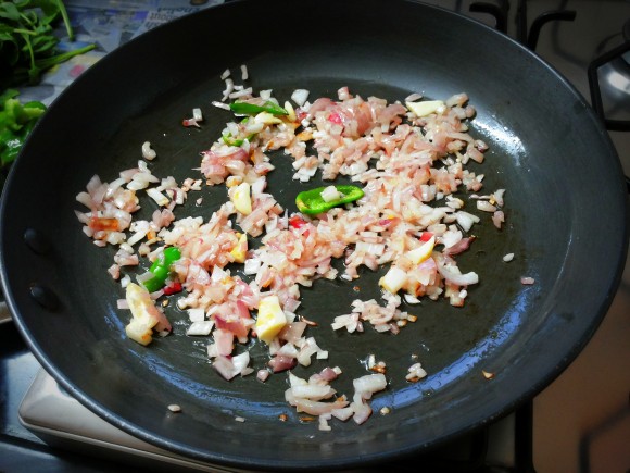 Add onion, green chilies and garlic 