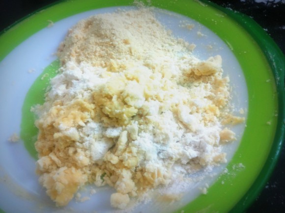 Add Maida along with baking powder and roughly grind cashew nut