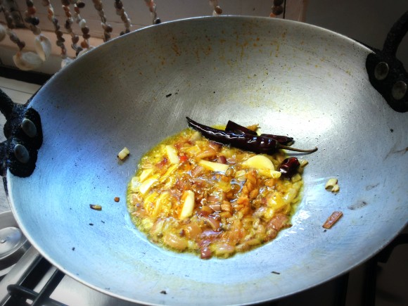 adding garlic into seasoning