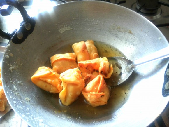 Dip this lavang latika into the sugar syrup