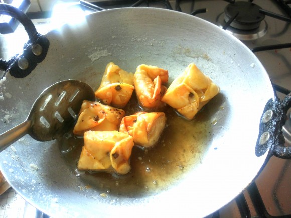 Dip this lavang latika into the sugar syrup