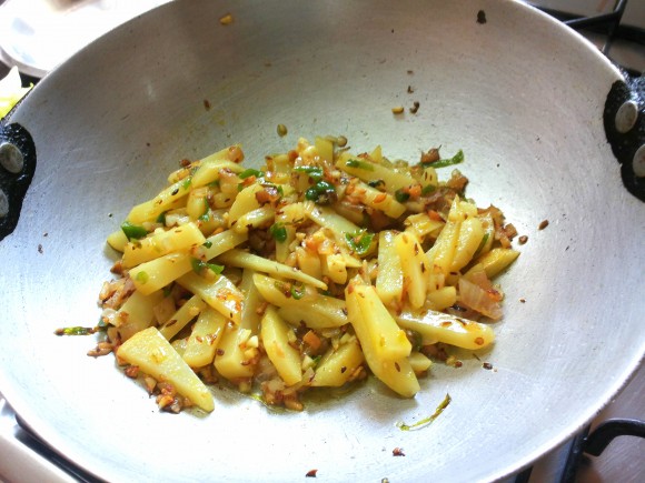 fry until potato is half done.