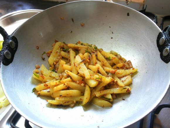 fry until potato is half done.