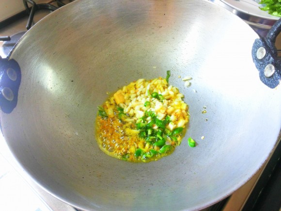 Add chopped garlic, green chili, and ginger