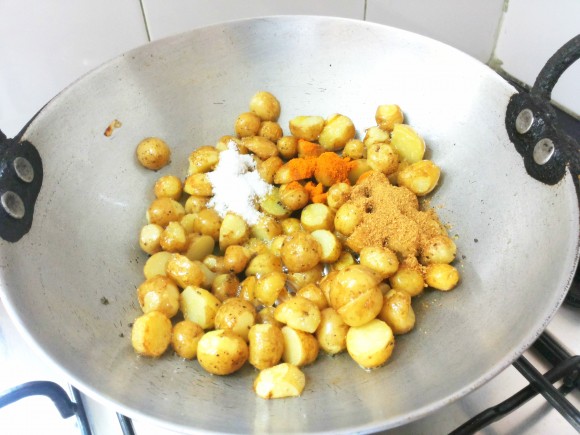 add coriander powder, turmeric powder and salt