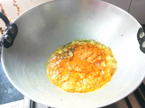 Add remaining chopped garlic and grounded rasam masala