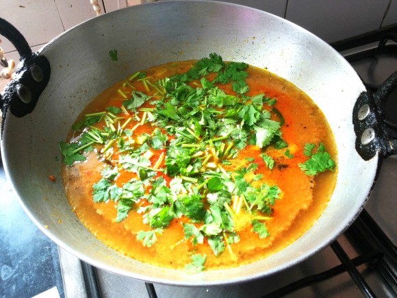 Add salt and tamarind pulp and fresh coriander leaves 