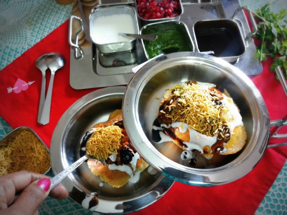 Sprinkle roasted cumin powder, salt, red chili powder, tamarind chutney and bhujia