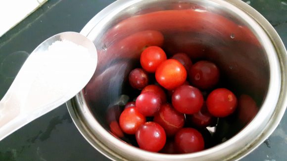 Put plum along with sugar, salt, and a glass of water and cumin powder