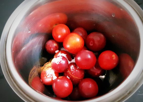 Put plum along with sugar, salt, and a glass of water and cumin powder