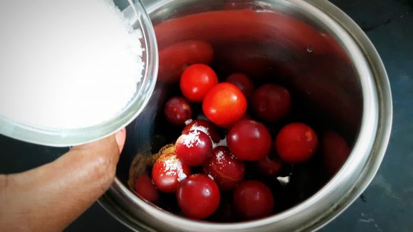 Put plum along with sugar, salt, and a glass of water and cumin powder