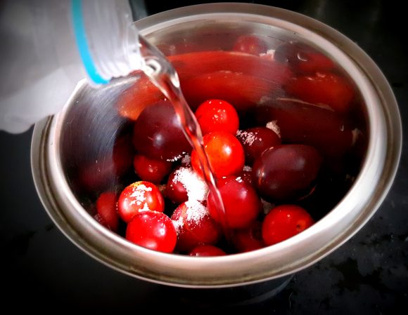 Put plum along with sugar, salt, and a glass of water and cumin powder