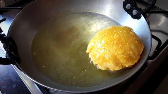 Deep fry the poori 