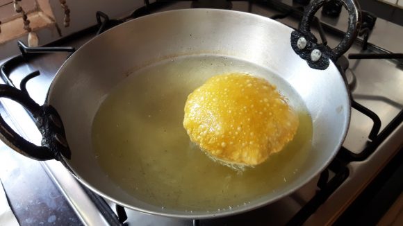 Deep fry the poori 