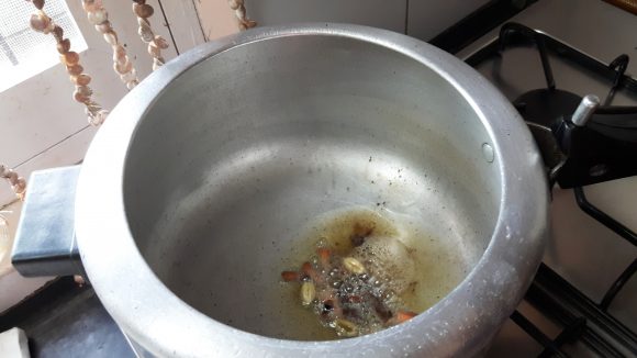 Put green cardamom, cinnamon and clove