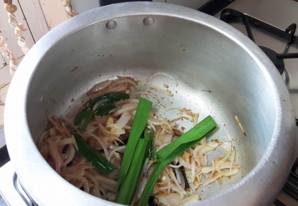 add sliced onion and ramba leaves