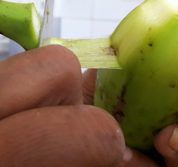 Discard the both ends and upper layer of raw banana