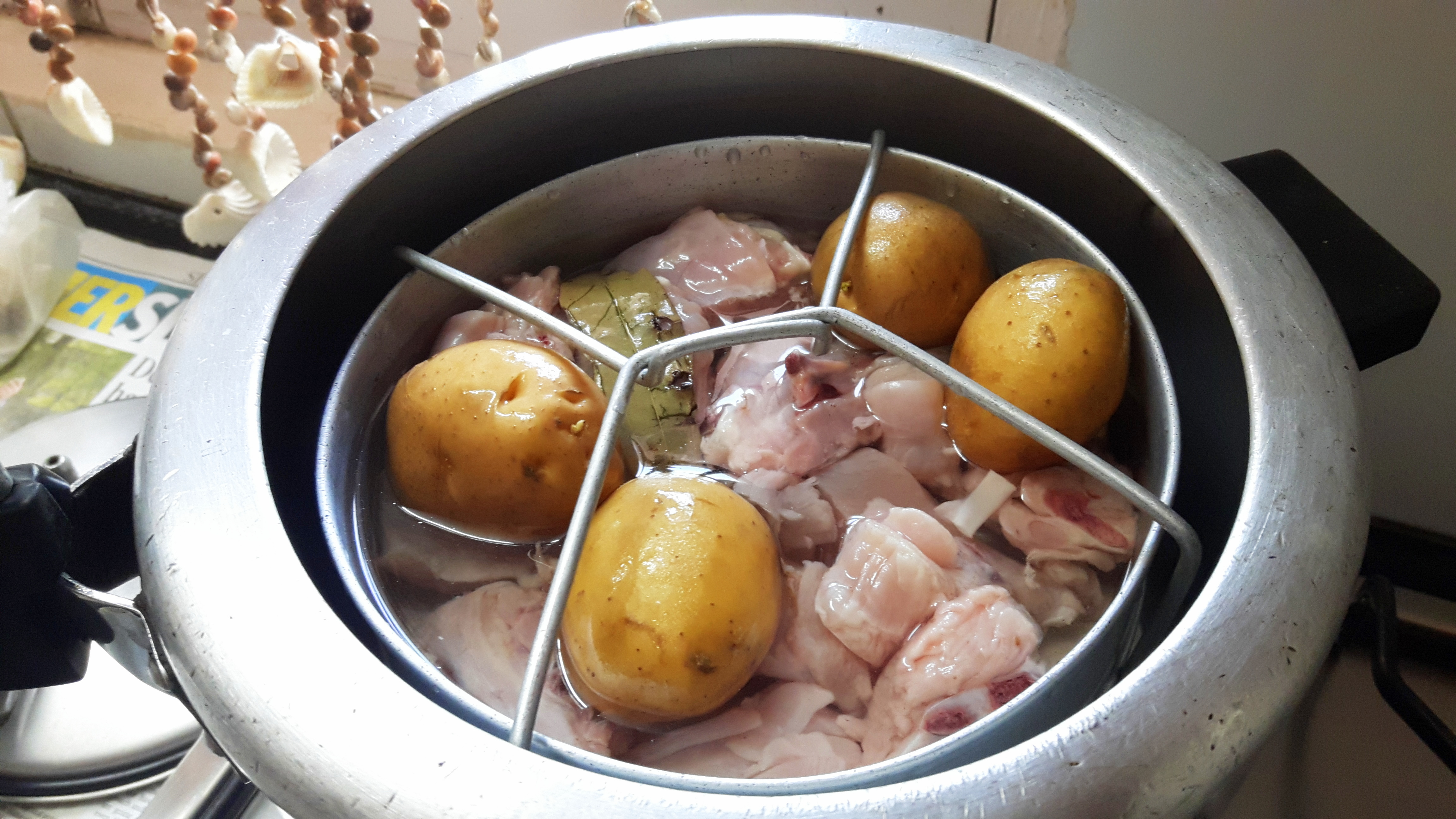 Boil the peeled potatoes with chicken