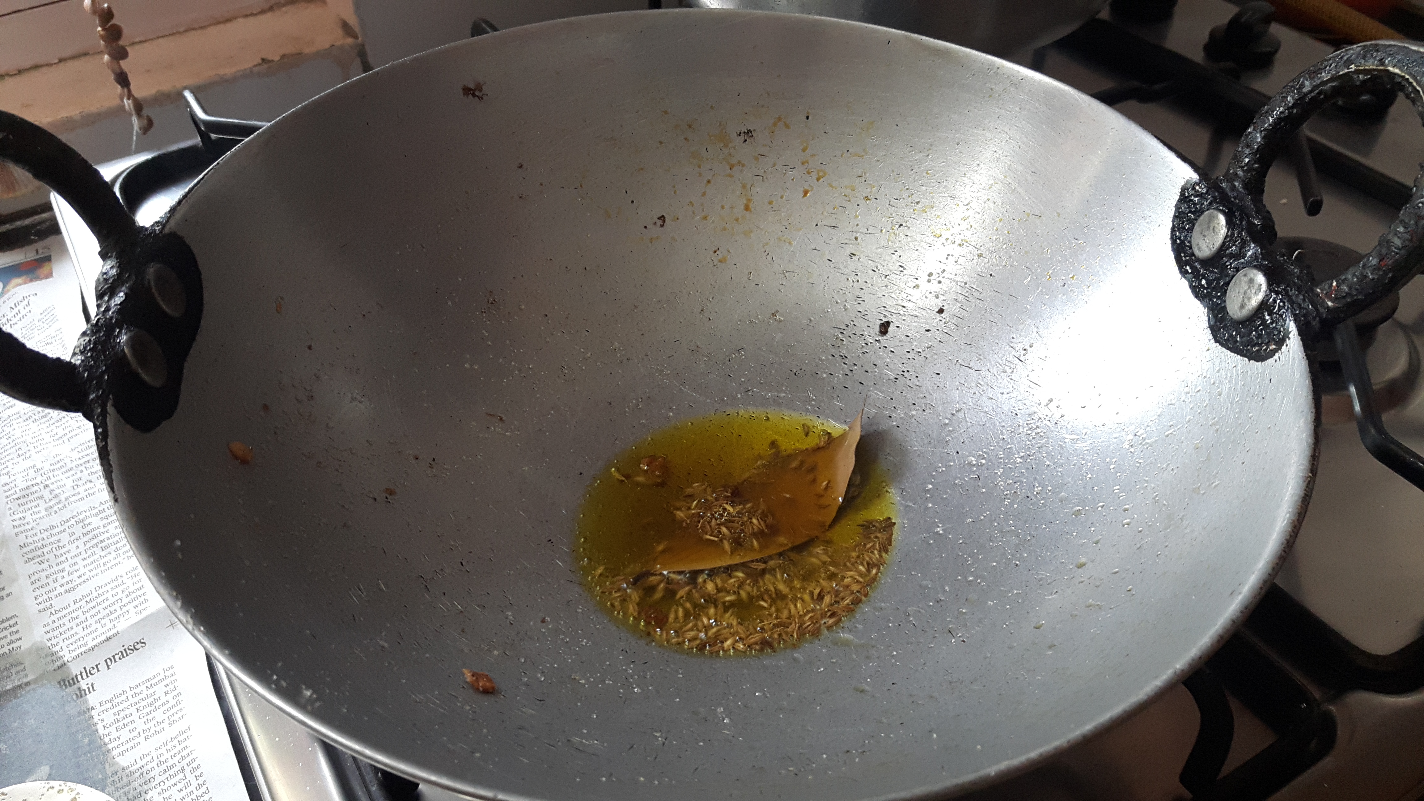 put 2 whole chilies, cumin seeds and bay leaf
