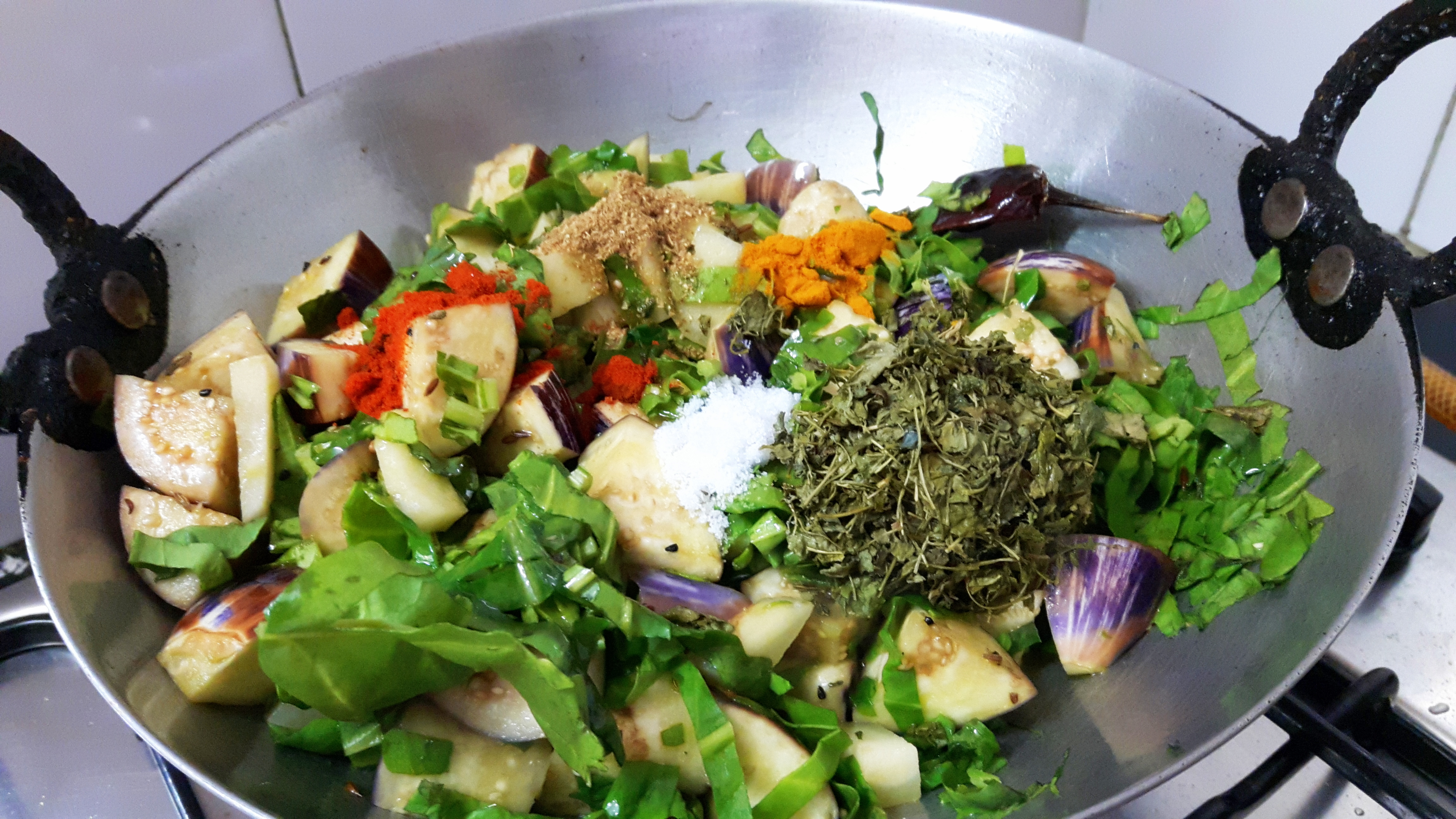add potato, spinach stir properly