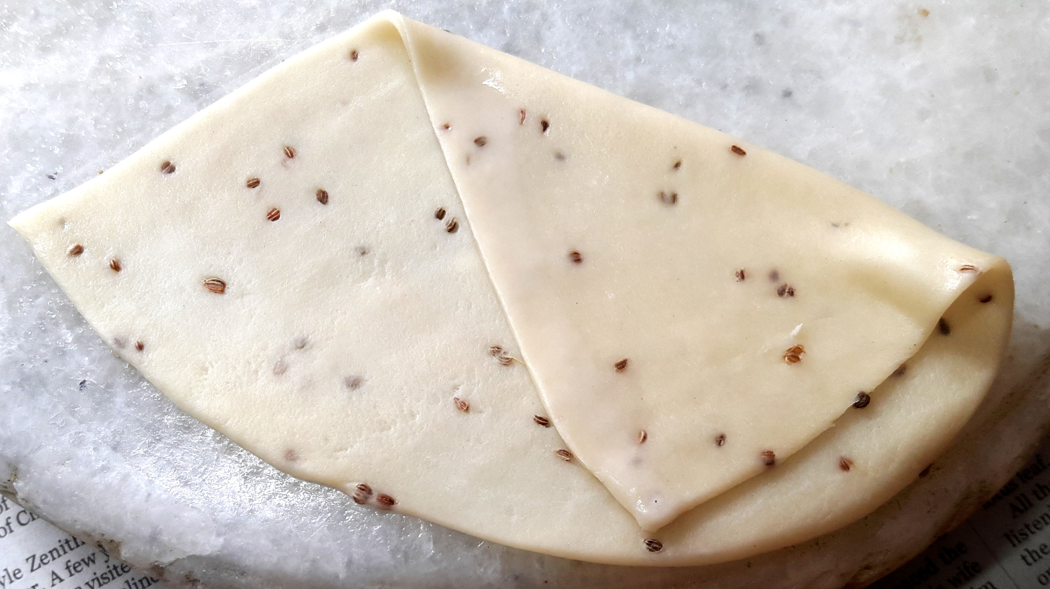 Take one piece and give this piece the cone shape