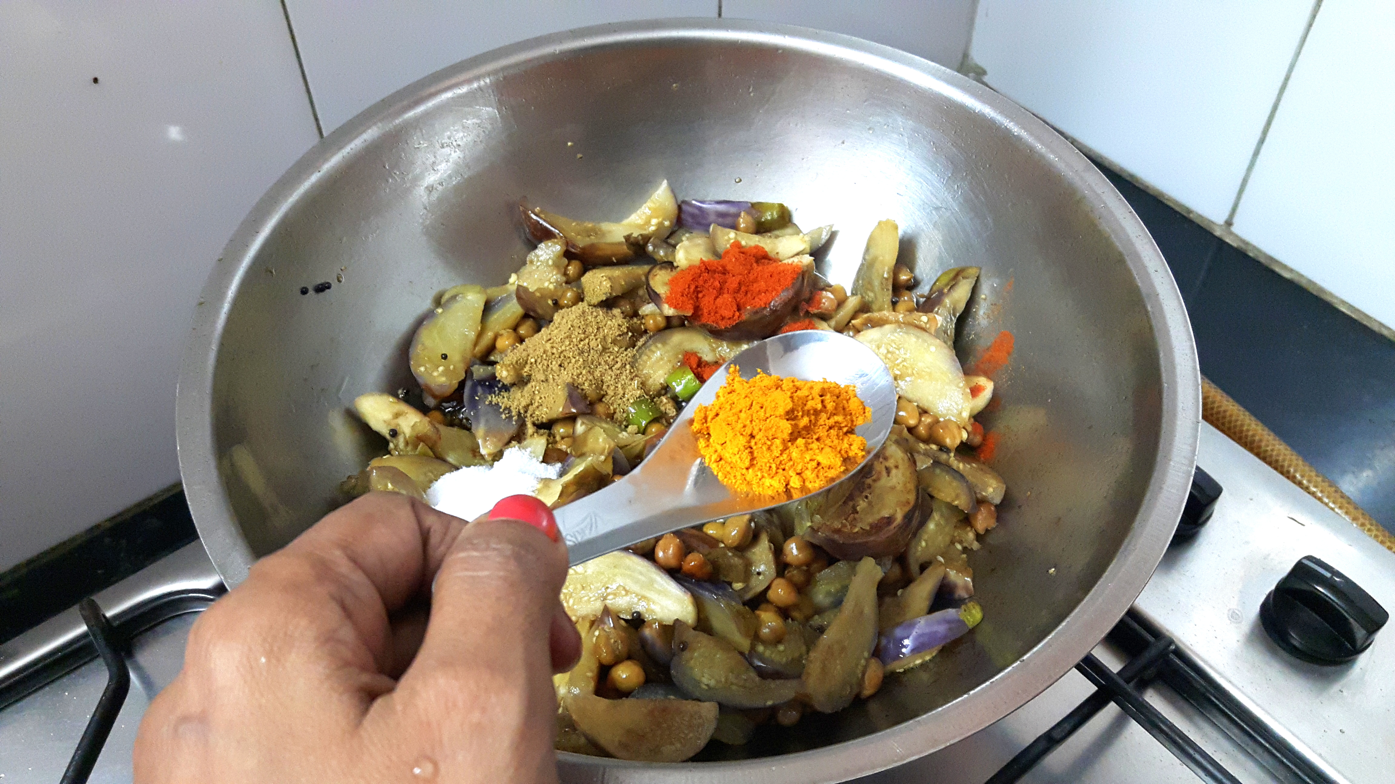 garlic paste, chili powder, turmeric powder, coriander powder and salt