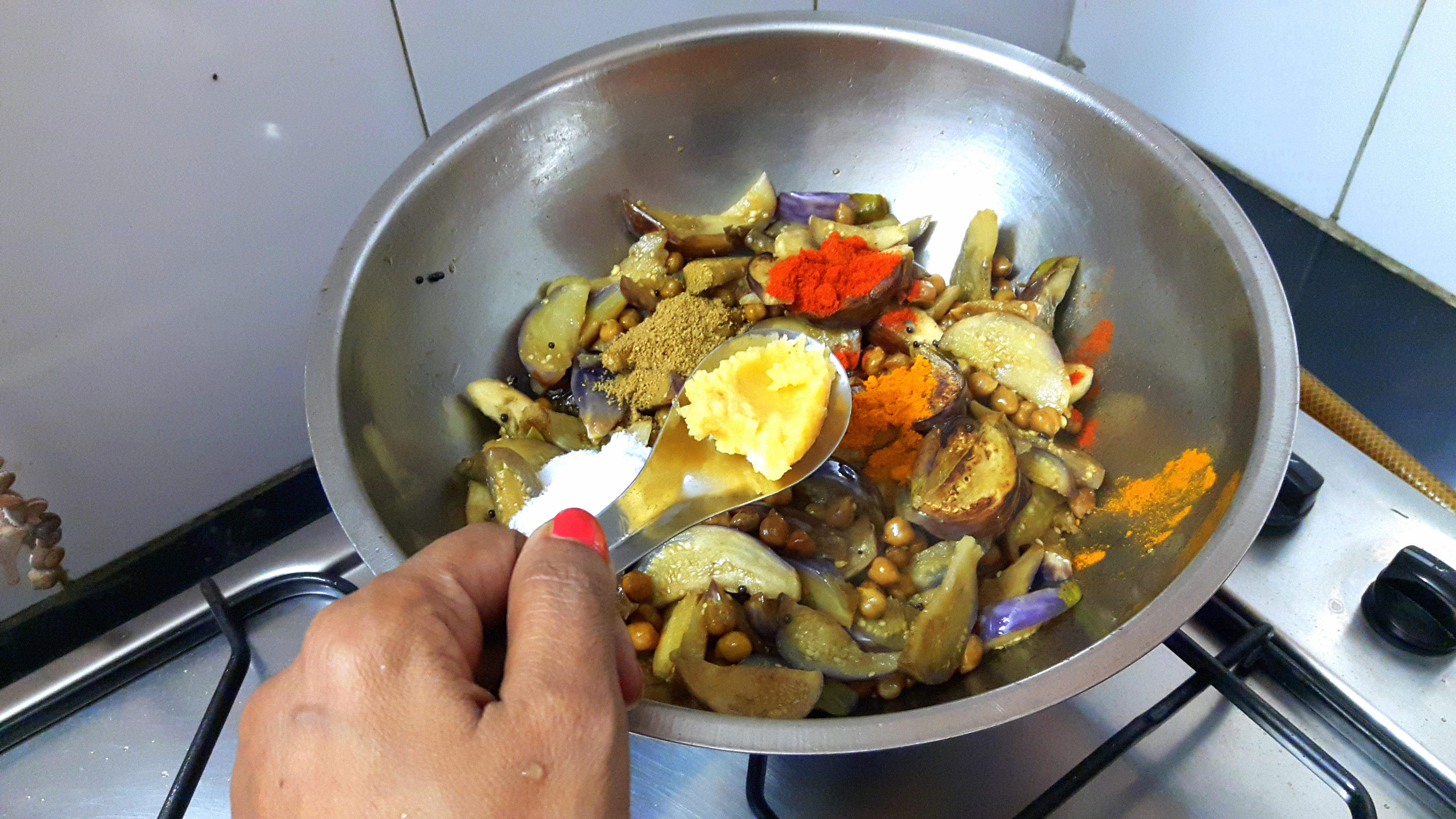 garlic paste, chili powder, turmeric powder, coriander powder and salt