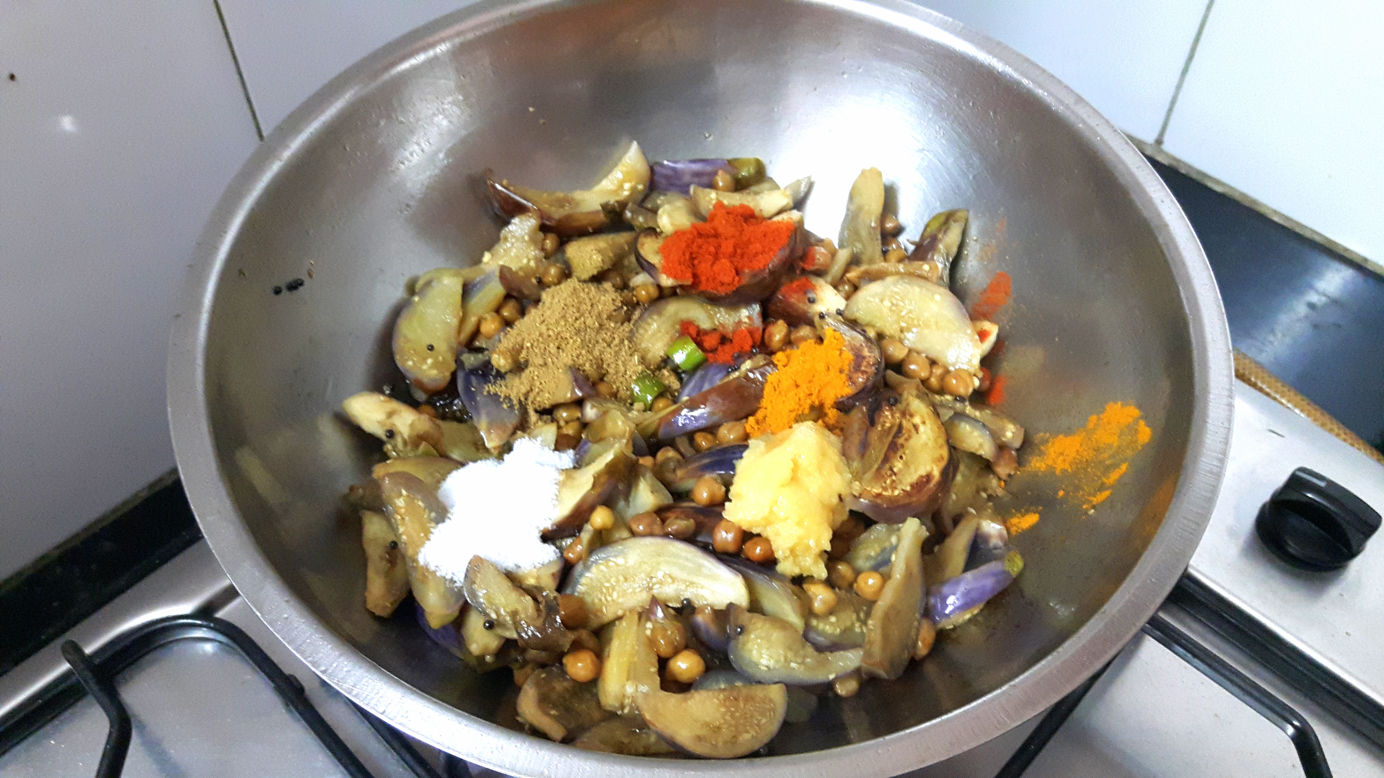 garlic paste, chili powder, turmeric powder, coriander powder and salt