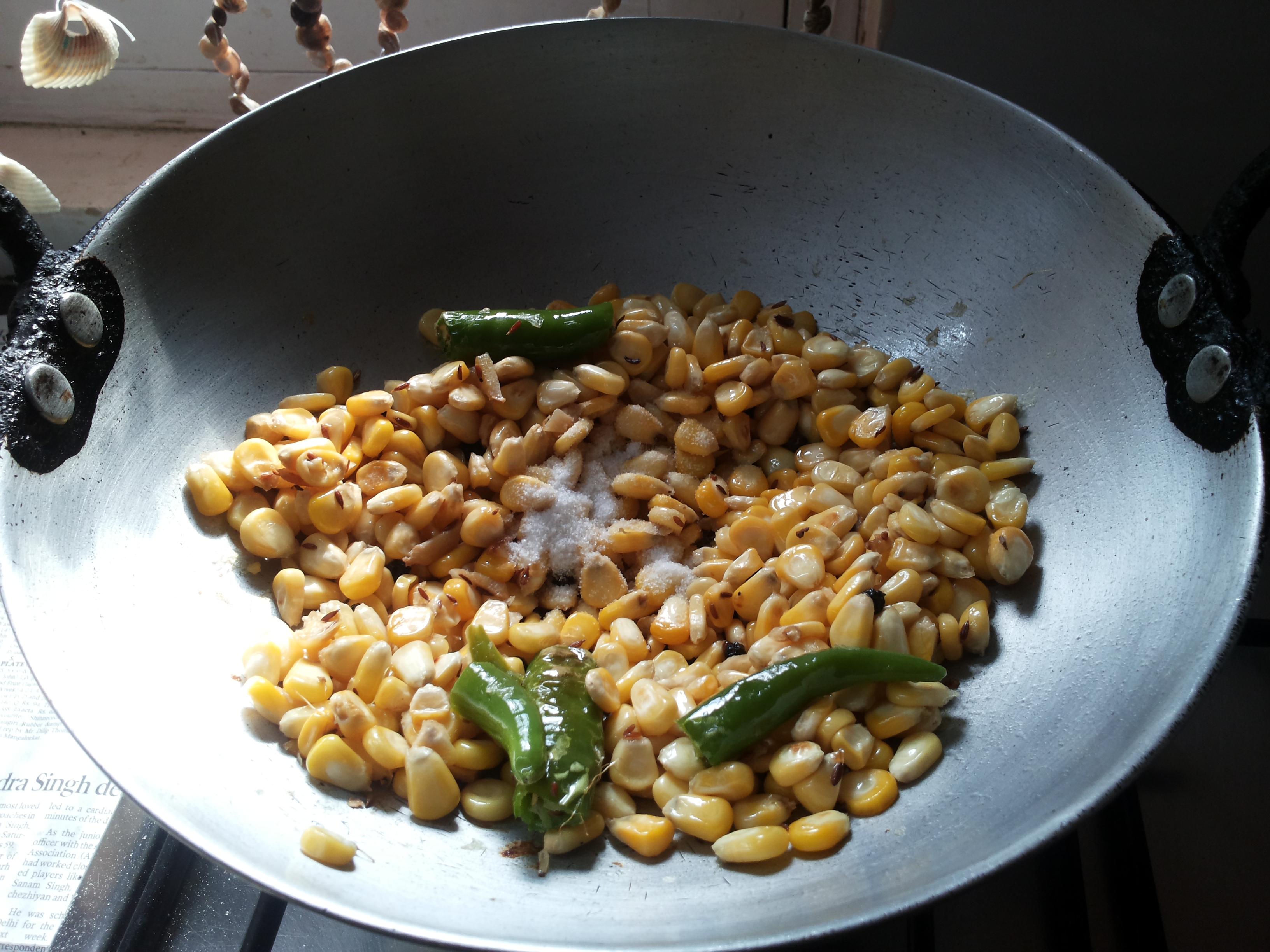 add asafoetida, corn and salt