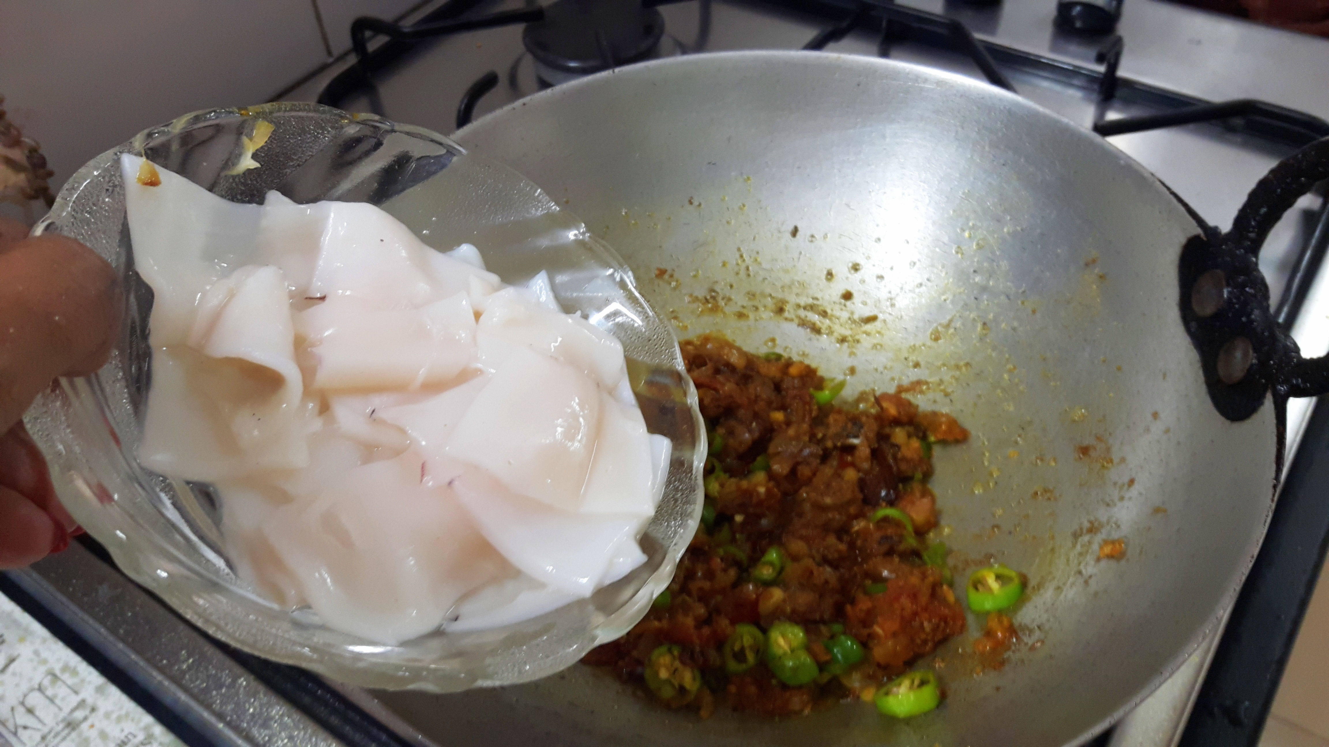 Add green chili and Squid (kanava fish)