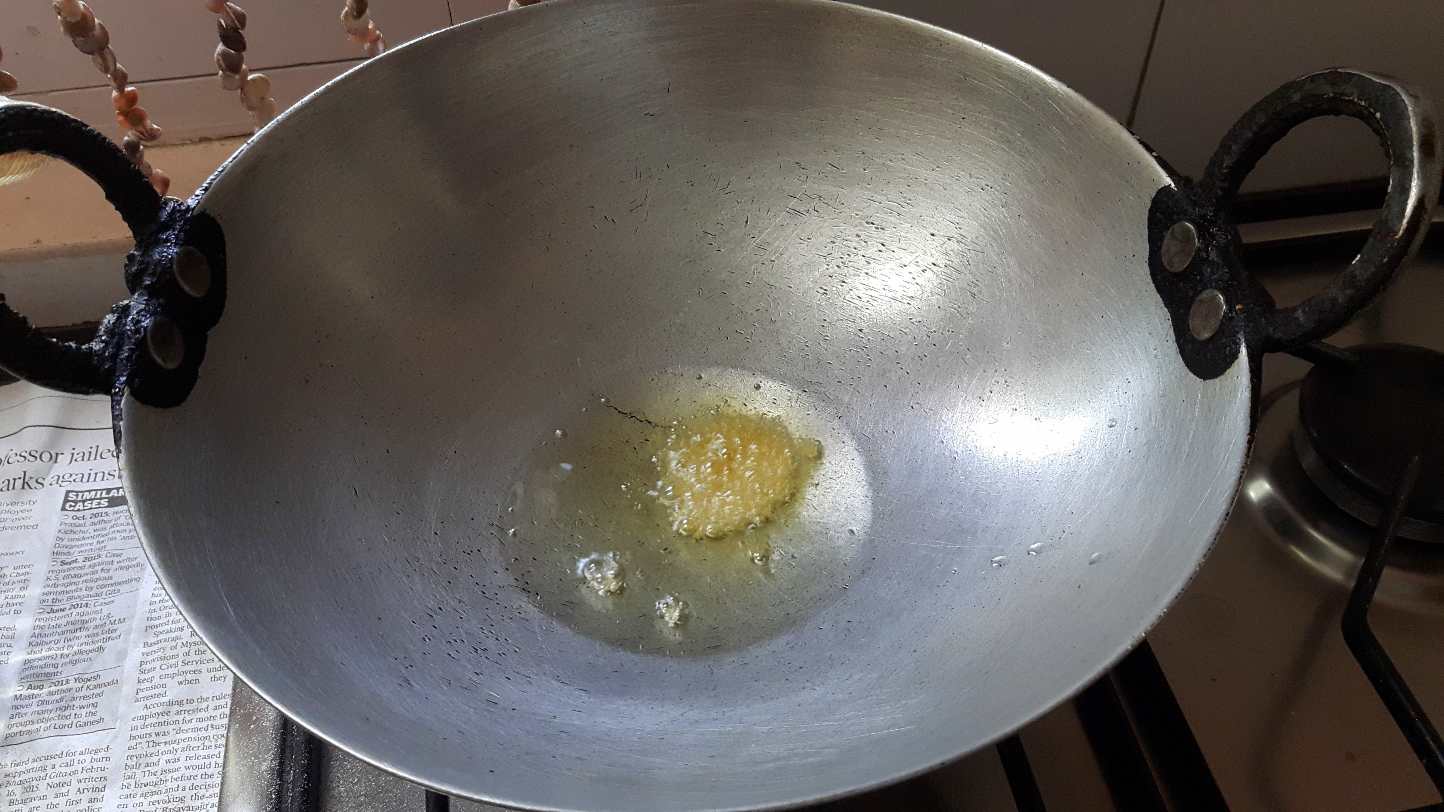 add split black gram, fenugreek seed, mustard seed, red chili, garlic, curry leaves and onion.