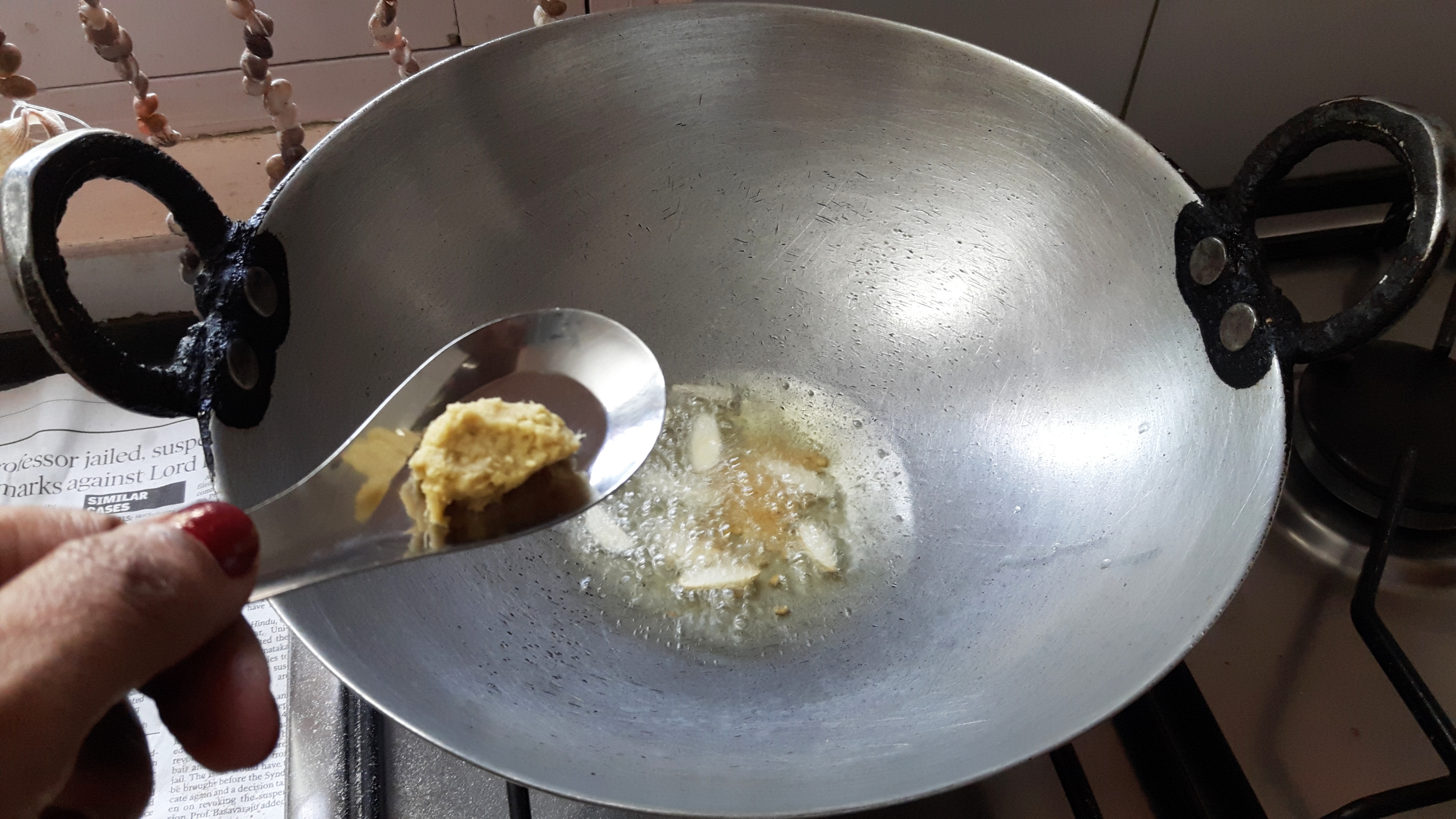 add split black gram, fenugreek seed, mustard seed, red chili, garlic, curry leaves and onion.