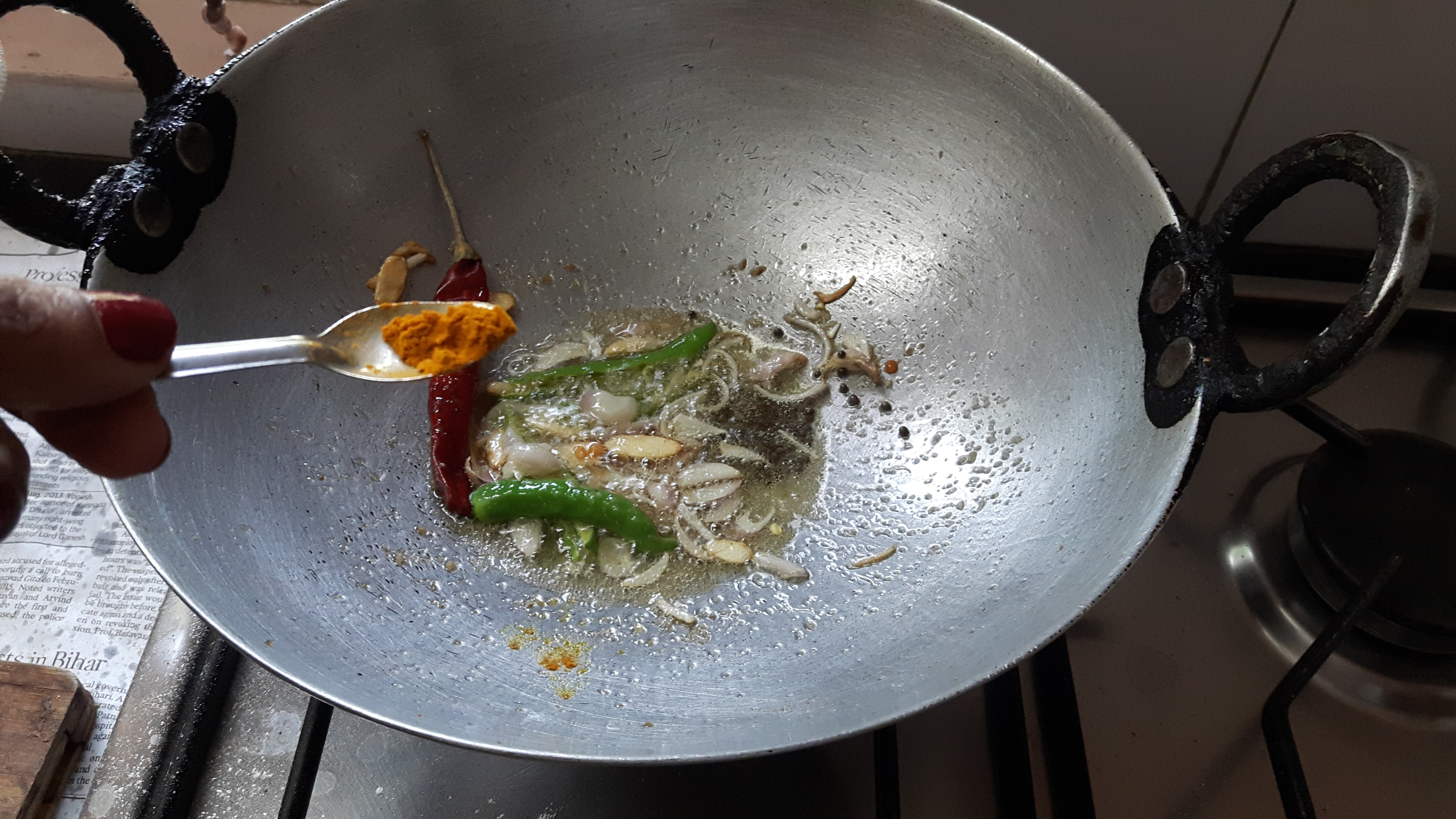 Add turmeric powder, salt and chili powder