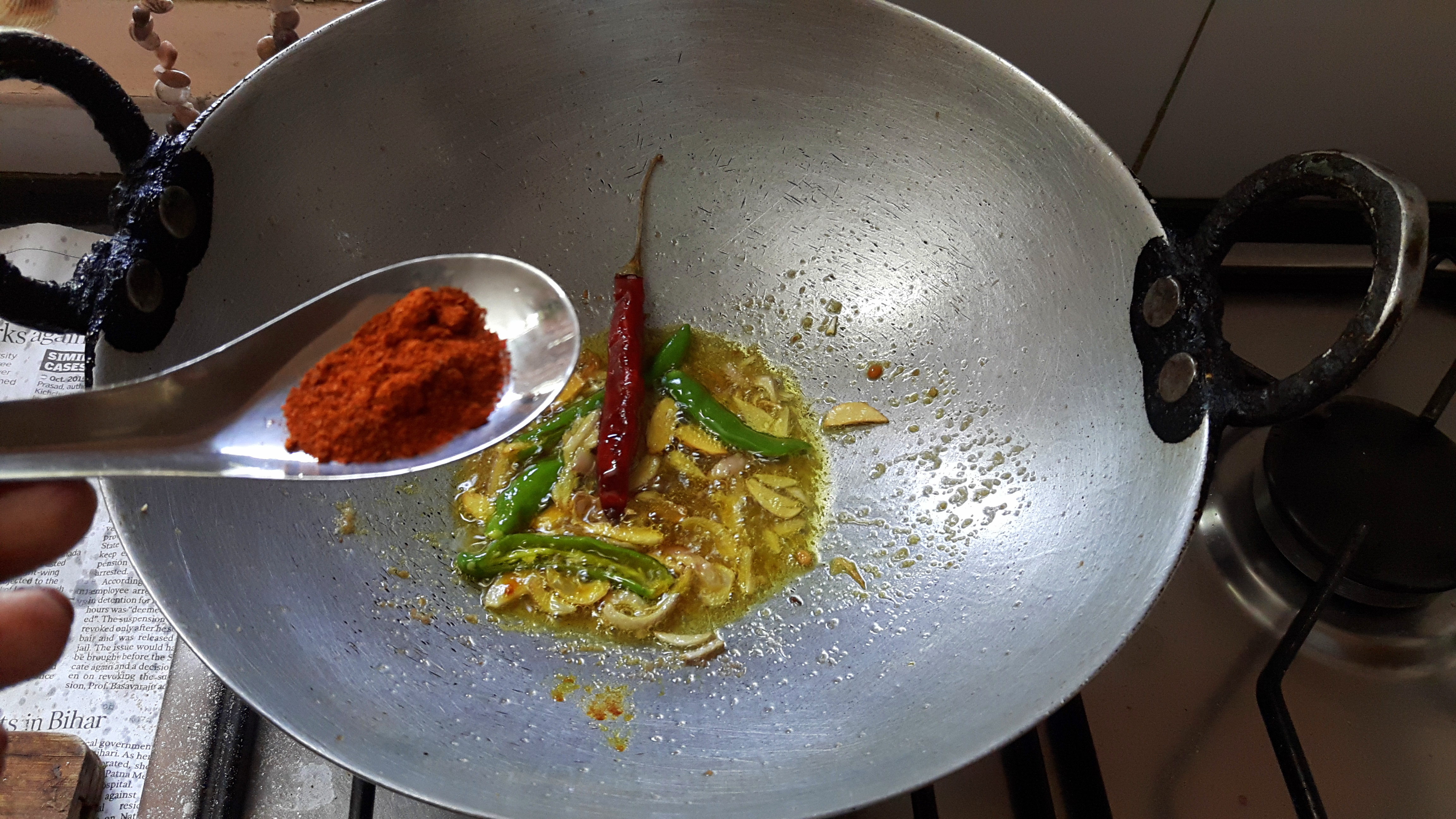 Add turmeric powder, salt and chili powder