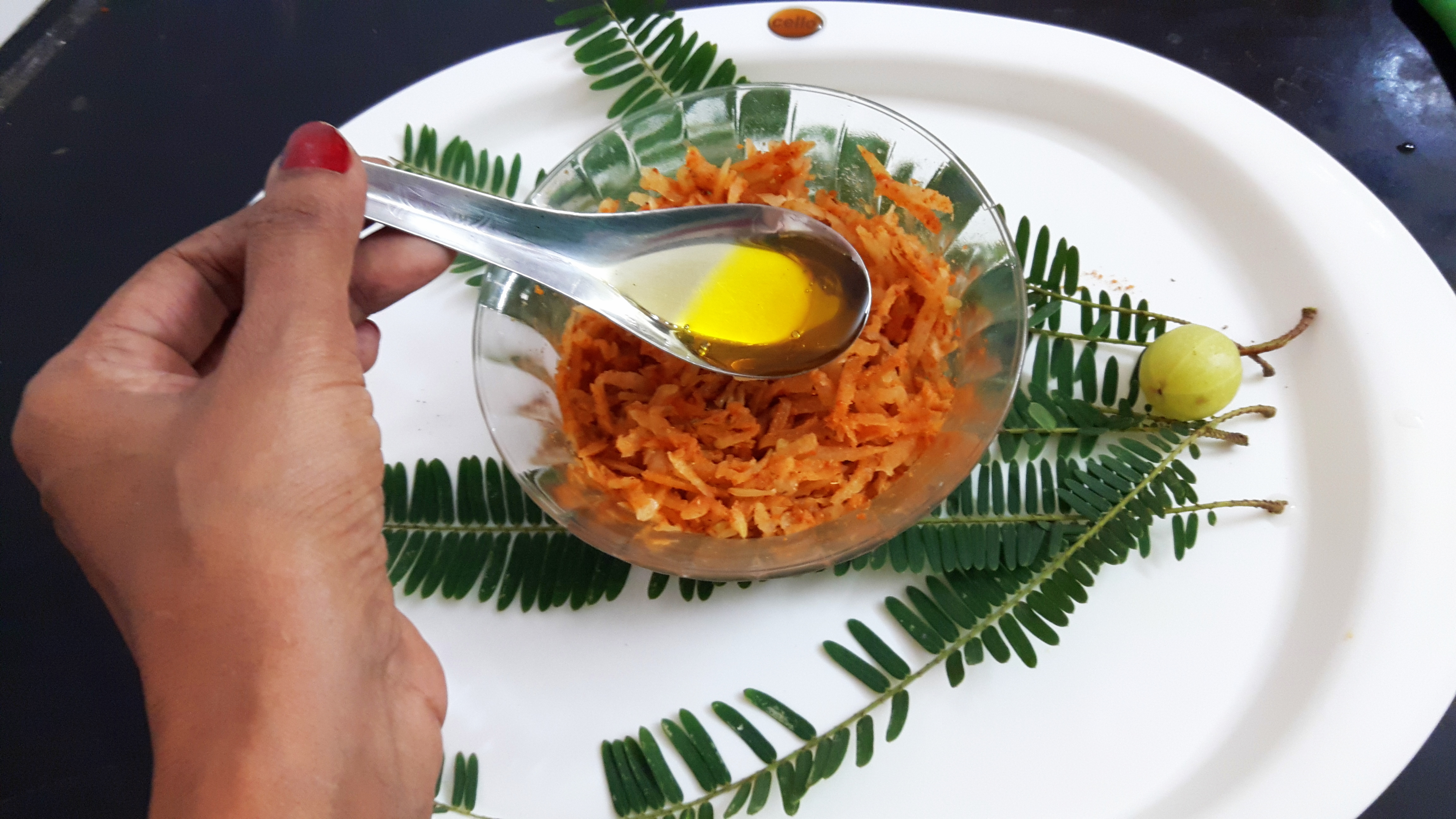 adding oil into the bowl